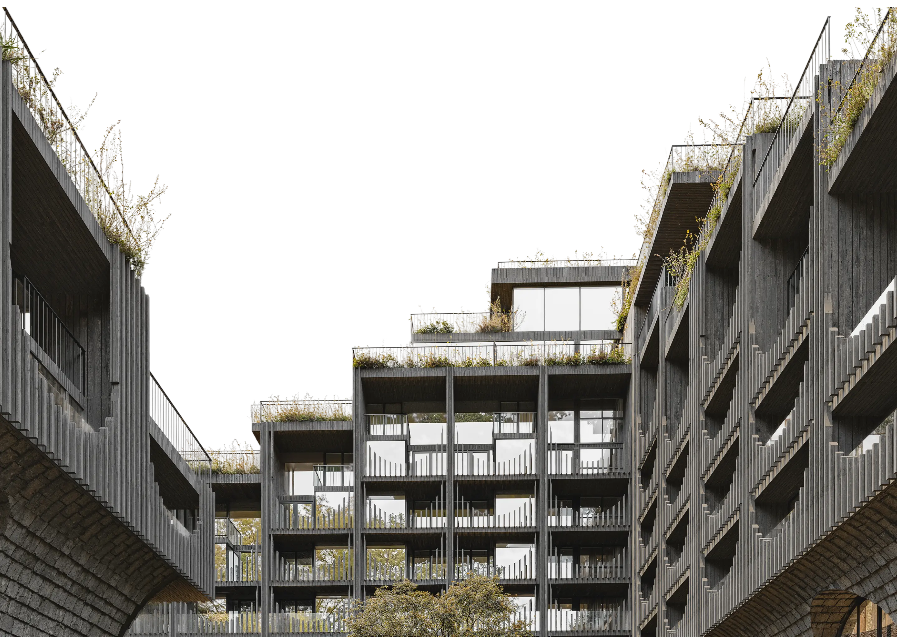 现代多层建筑，大面积开窗与阳台，屋顶与栏杆绿植点缀。